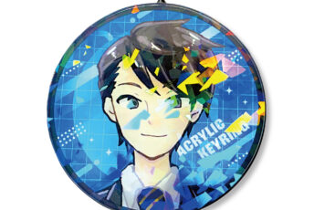 Round hanging ornament featuring a cartoon portrait with colorful confetti on a blue geometric background, suspended by a metal chain.